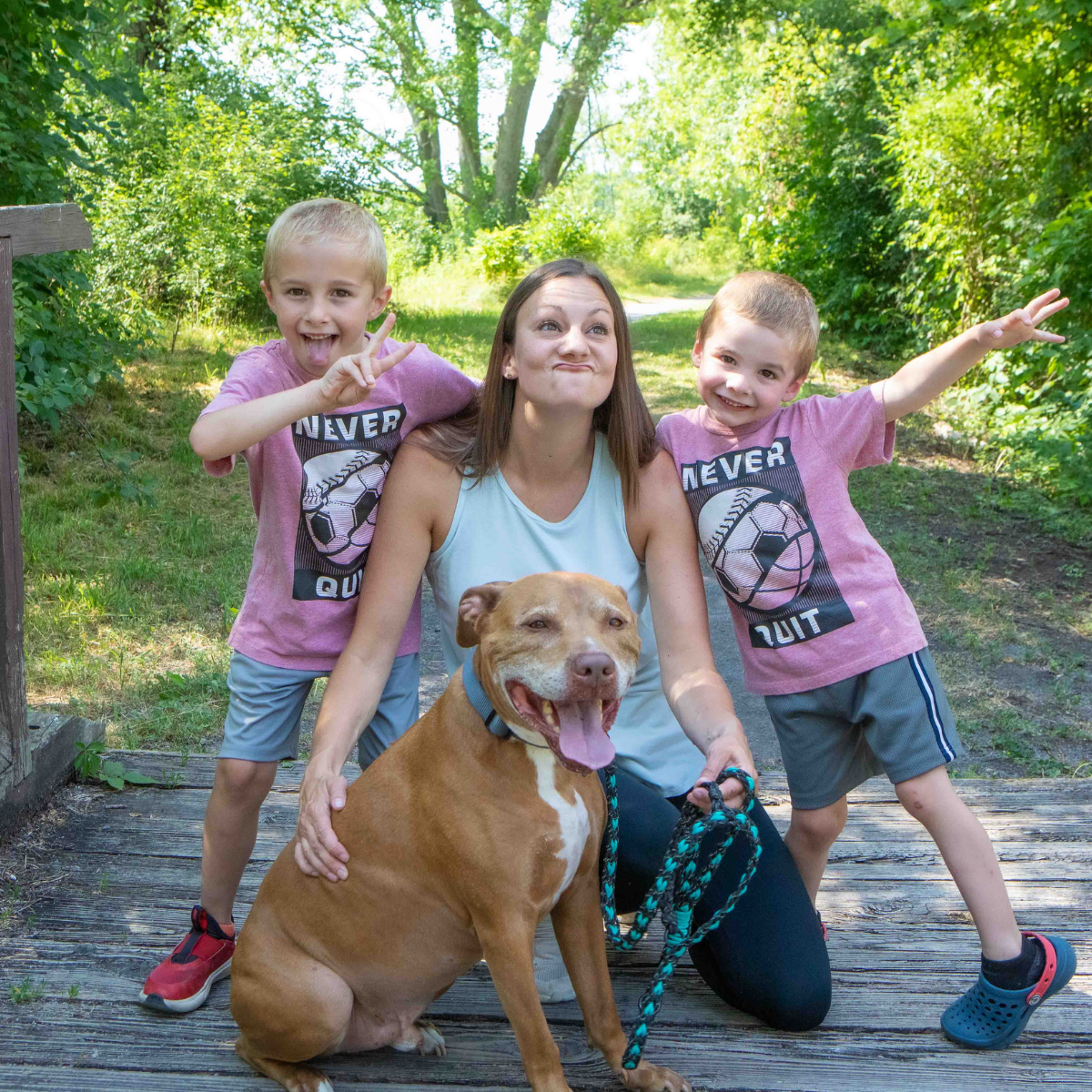 person with kids and dog